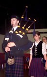 The piper plays for highland dancing, by Marion Power