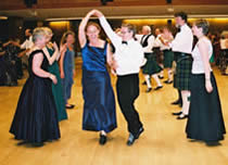 Scottish  dancing in set formation at a Brighton Summer Ball, demonstrating how to turn under (Annie Hill)